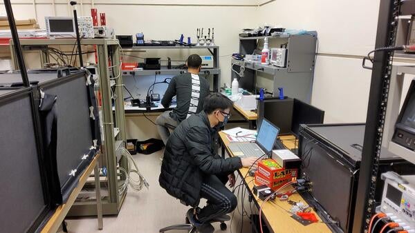 Peter Carney and JiaJun Huang working at the lab