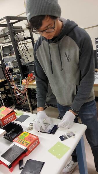 Miguel Rodriguez assembling scintillator layer