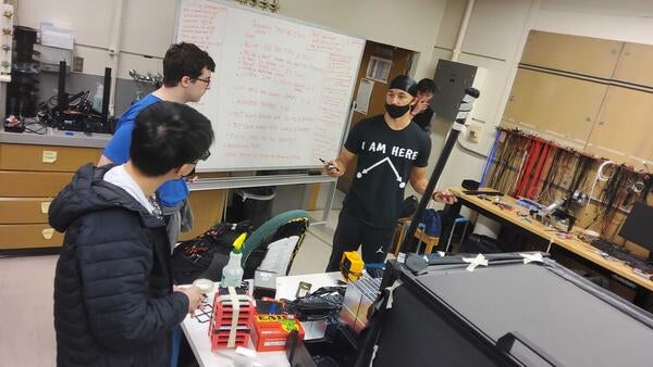 Jiajun Huang, Sean Preins, Peter Carney and Bruce Bagby preparing for JLab test