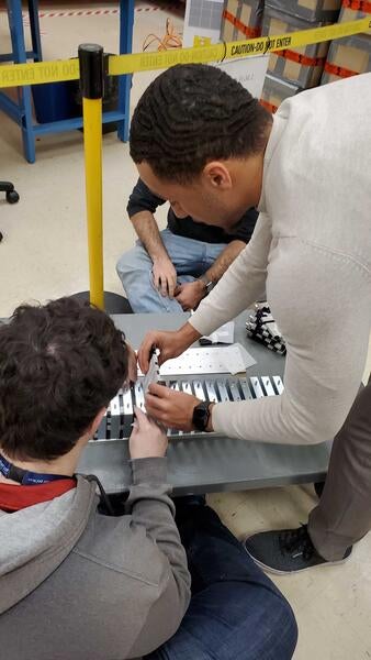 Peter Carney and Sean Preins building calorimeter prototype