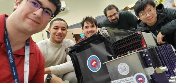 Sean Preins, Peter Carney, Bruce Bagby, Sebouh Paul and Jiajun Huang with a calorimeter prototype