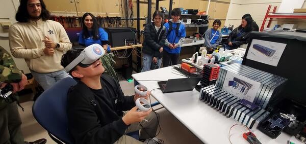 Highschool students visiting laboratory and using a virtual-reality event display for events for the EIC