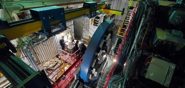 Panonamic view of Peter Carney, Ryan Tsiao and Yousef Abdelkadous installing prototype in the STAR Hall at RHIC