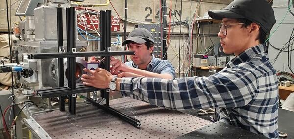 Miguel Rodriguez and Barak Schmookler mounting irradiation stand in UC David Cyclotron, during May 2024 campaign. SiPM testing for EIC