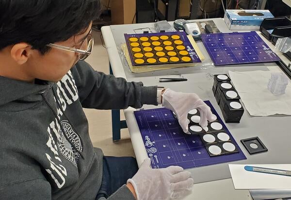 Miguel Rodriguez assembling board for gen-3 prototype