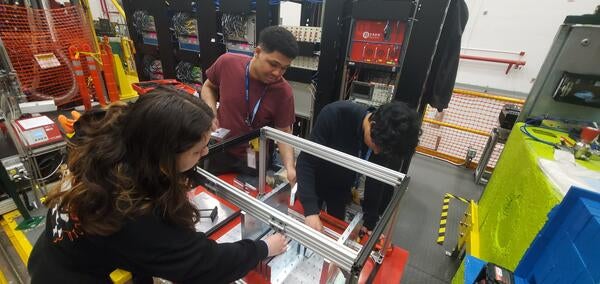 Mia Macias, Brice Saunders and Ryan Tsiao assembling gen-3 ZDC prototype at Jefferson National Laboratory for testing at Hall-D