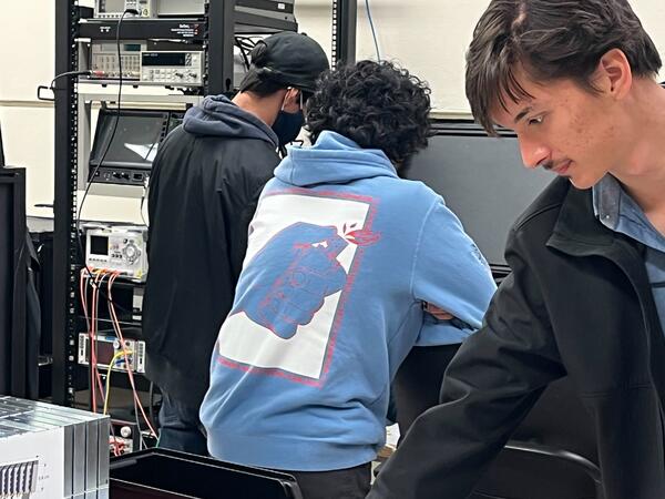 Miguel Rodriguez, Samir Kulkarni and Bruce Bagby working in the lab