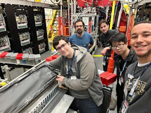 Sean Preins, Sebouh Paul, Bruce Bagby, JiaJun Huang and Peter Carney at Hall-D in Jefferson Laboratory testing calorimeter prototype