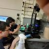 Sean Preins and Luis Garabito checking a 3D printer