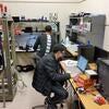 Peter Carney and JiaJun Huang working at the lab