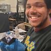 Brice Saunders with scintillator cell for gen-3 prototype