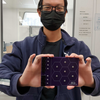 JiaJun holding PCB that he soldered. SiPM-on-tile design prototype for Electron-Ion Collider. Hexagon cell design. EIC R&D calorimetry.
